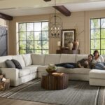 Best home furnishings sofa with happy couple in living room.