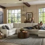 Best home furnishings sofa with happy couple in living room.